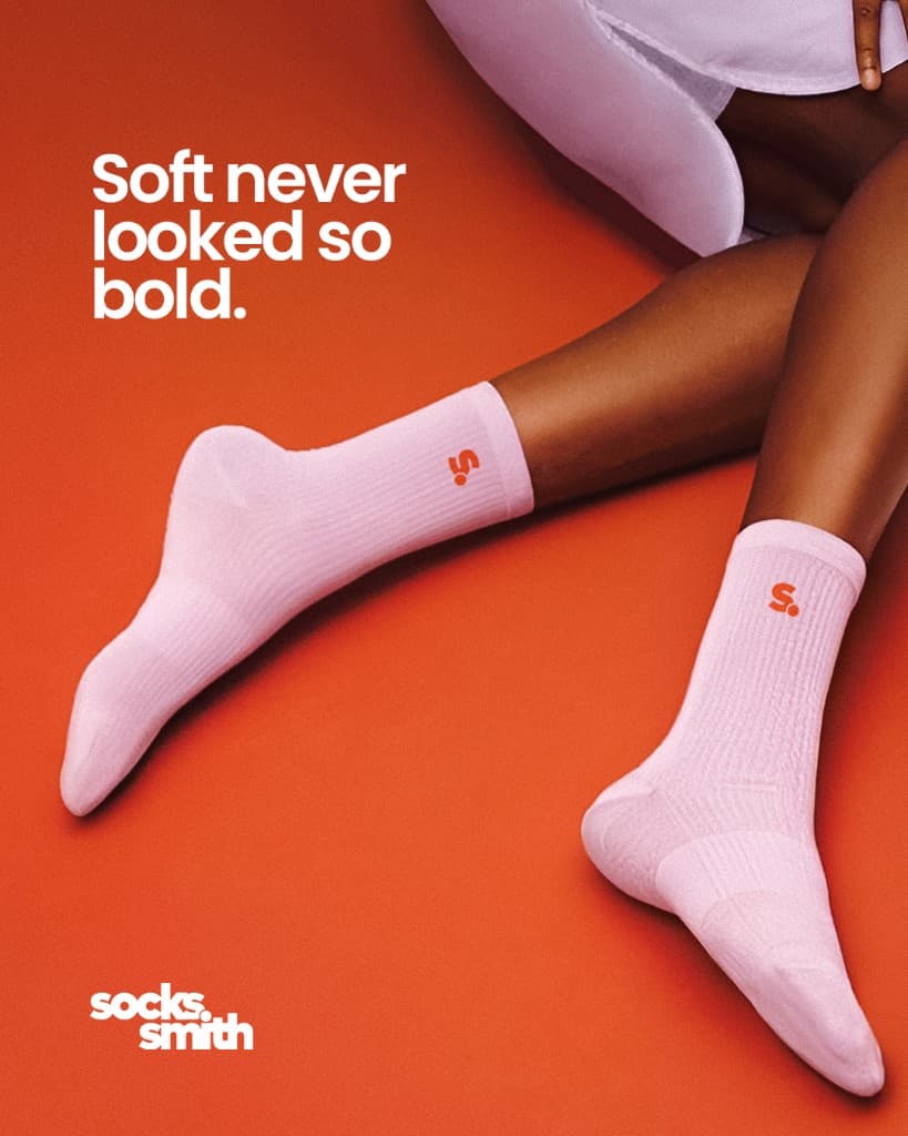 Soft pink socks on bold orange